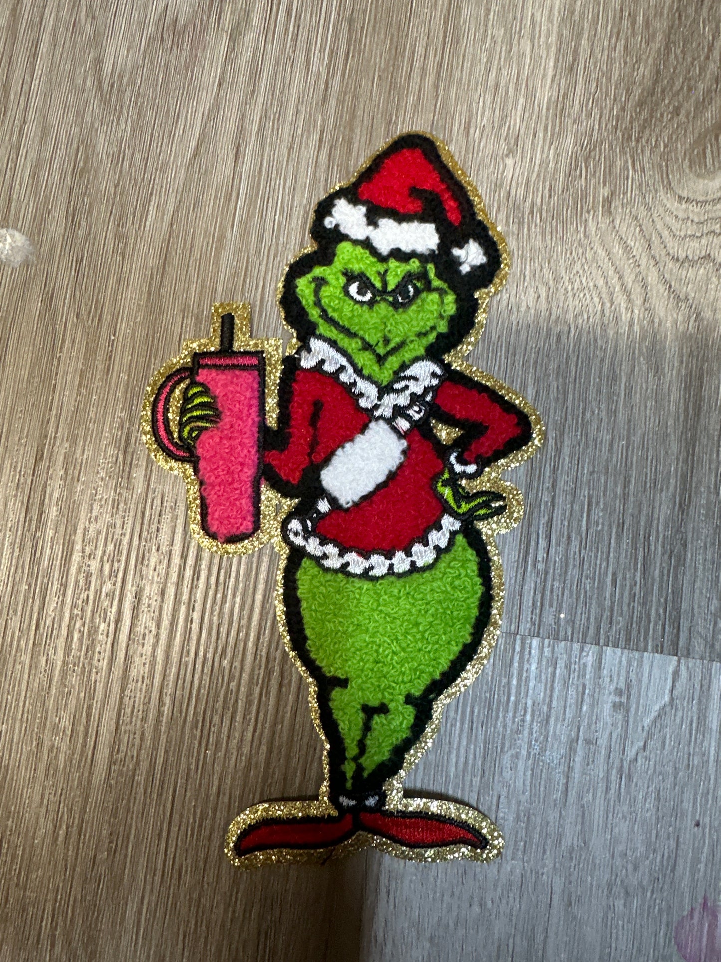 Grinch with pink Tumbler